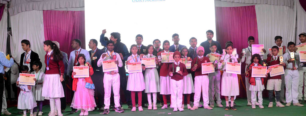 School students receiving awards on stage